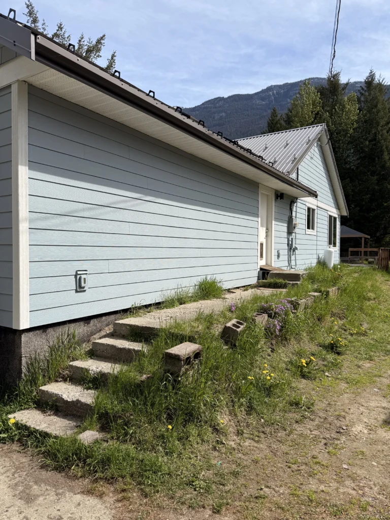 granite retaining wall replacement Pemberton BC, notice the erosion